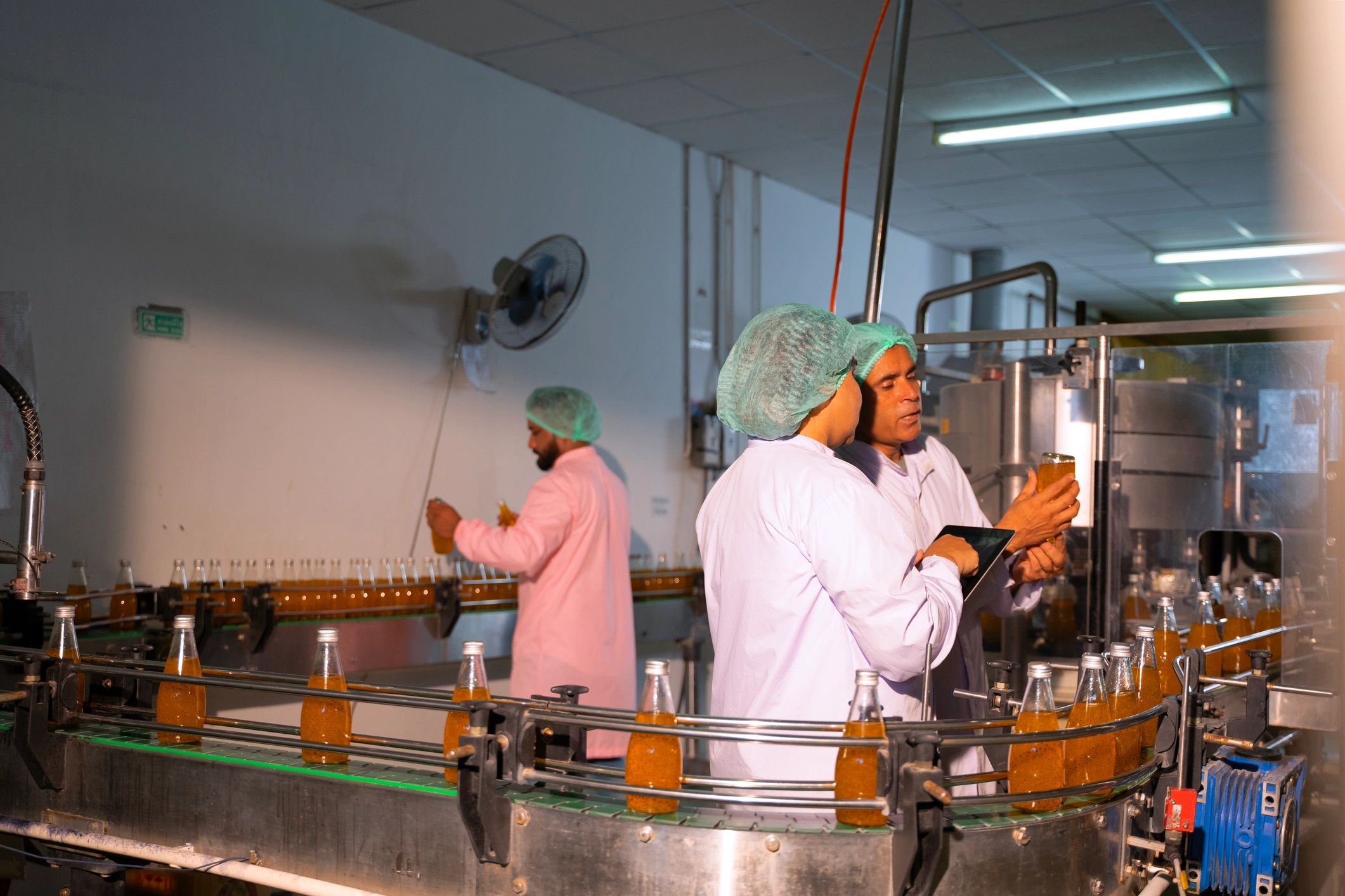 Production team in a food facility used as testimonial avatar