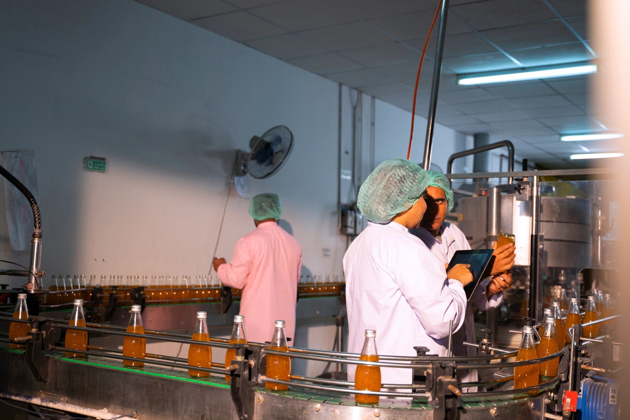 Quality control team working in a modern food processing facility