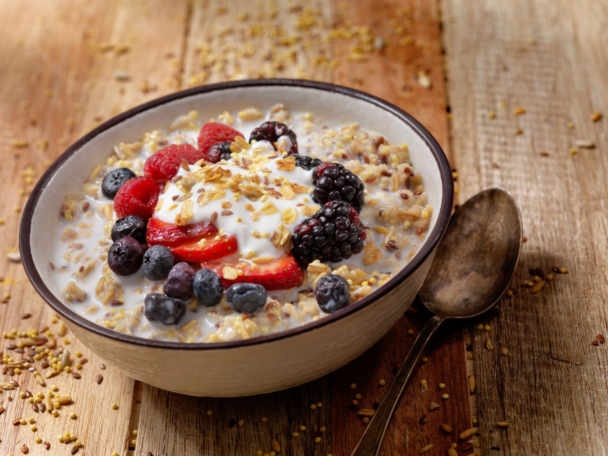 Breakfast cereal and grains with yogurt and fresh fruit